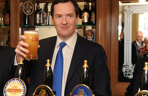 Chancellor holding a pint of ale