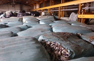 Image shows baled waste inside a warehouse