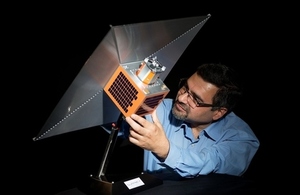Image of a satellite with the space sail