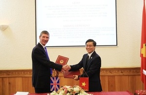 British Ambassador Giles Lever and Vice Minister of Justice Nguyen Khanh Ngoc at the signing ceremony