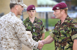 Lance Corporal Stephen Lewis, 2nd Battalion The Parachute Regiment (right), receives his (US) Navy and Marine Corps Achievement Medal from Major Timothy Wernimont, United States Marine Corps