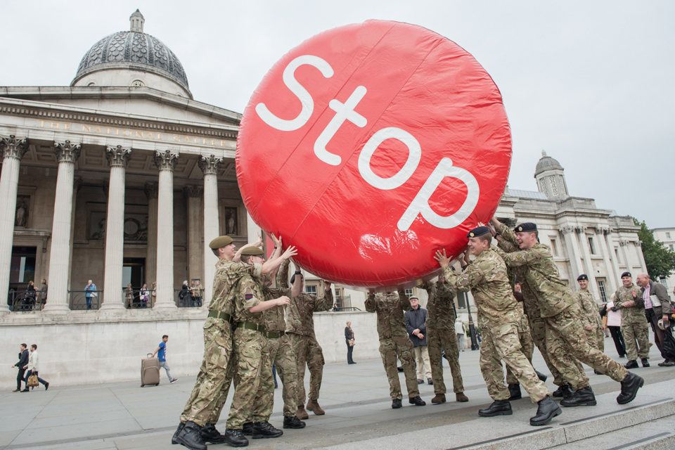 Soldiers with the 'Stop' disk in Trafalgar Square