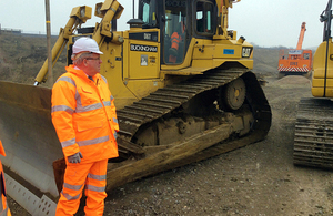 Transport Secretary Patrick McLoughlin surveys the work to build a new line at Bicester