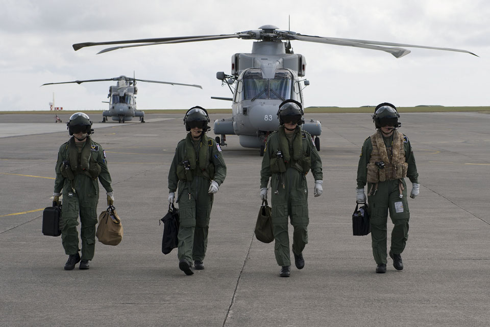 Crew members leaving two of the new Merlin Mk2 helicopters