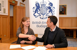 Director of Amnesty International Hungary, Orsolya Jeney, and Head of Policy Team at the British Embassy in Budapest, Ben Luckock, signing the sponsorship agreement