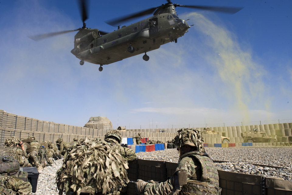 Royal Marines wait to board an RAF Chinook