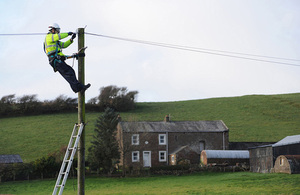 Engineer working on a telegraph pole