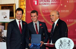 Adam Taylor accepting his award from Nick Clegg and Vince Cable
