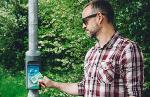 A man taking using radio-frequency identification as part of the Beat the Street programme.