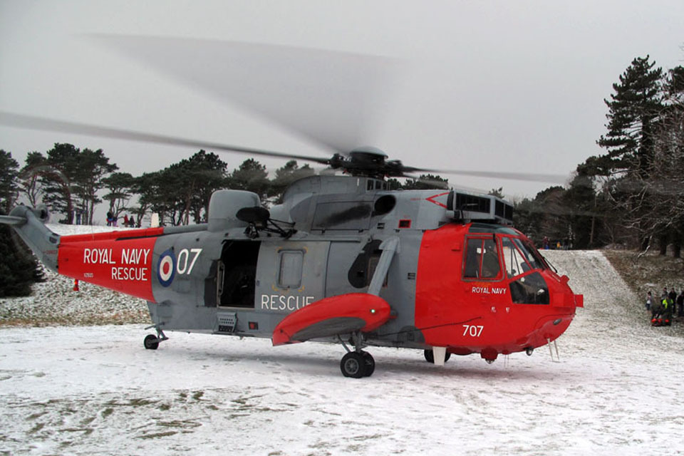 Navy Search and Rescue crew in snow rescue