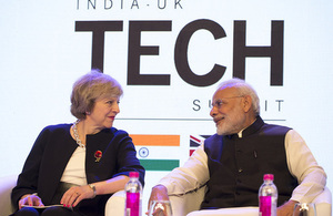 Prime Minister Theresa May and Indian Prime Minister Narendra Modi speaking at the India-UK Tech Summit