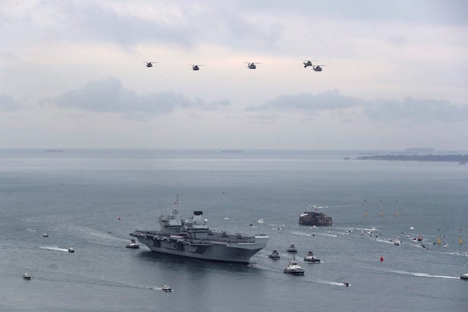 Queen to commission namesake aircraft carrier in just three weeks, Defence Secretary announces on flight deck
