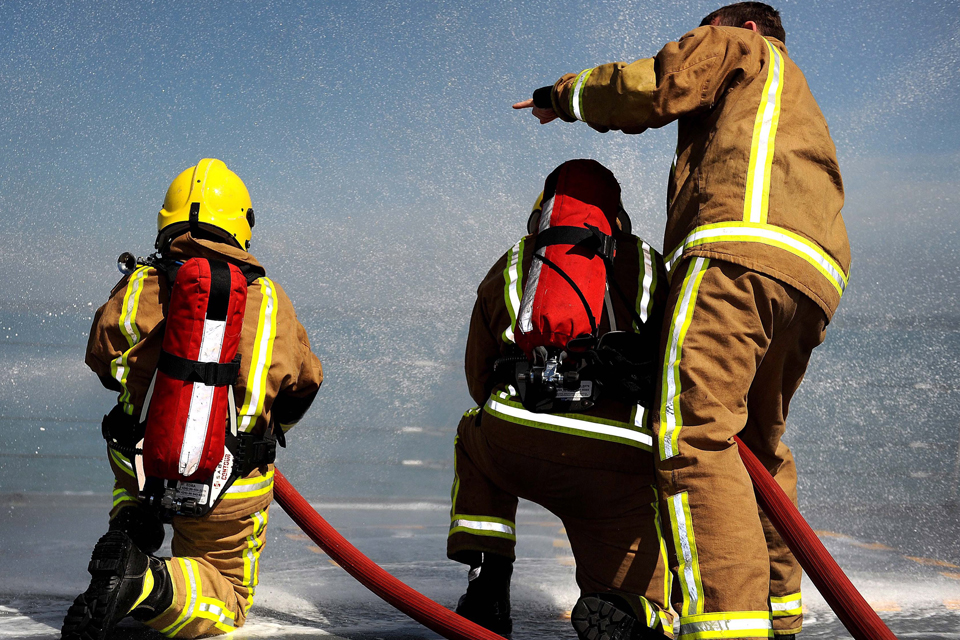 Crew family members have a go at firefighting on board HMS Edinburgh