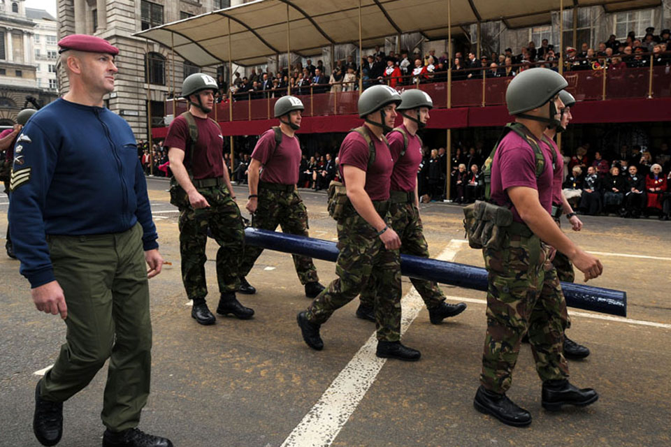 Paratroopers demonstrate a log run at the Lord Mayor's Show 