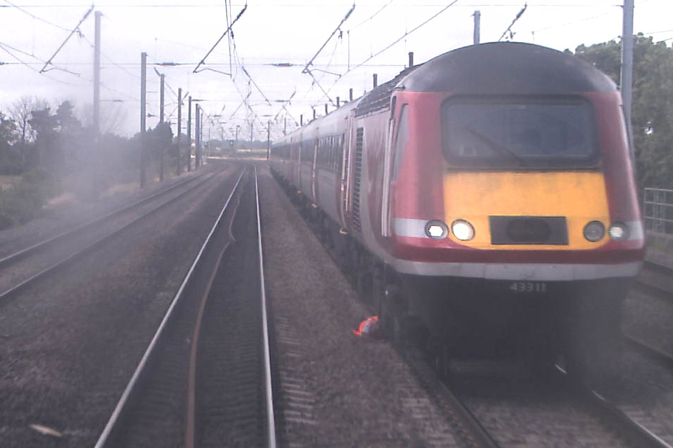 Still image from forward facing CCTV of train 1S16 showing the driver of 1E13 lying in the space between the Up and Down Fast Lines (courtesy Virgin Trains East Coast)