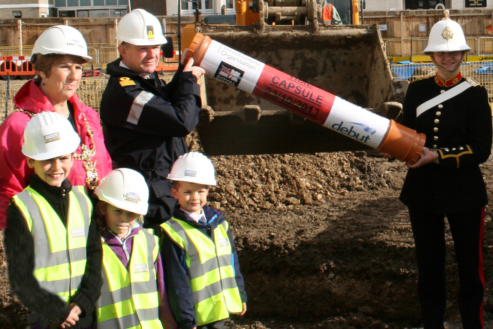 Children bury treasures beneath new Portsmouth Navy block