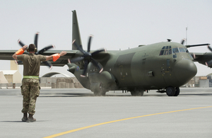 Ground engineers seeing off an RAF C-130J from the Tactical Air Transport flightline at 904 Expeditionary Air Wing, Kandahar Air field, Afghanistan.