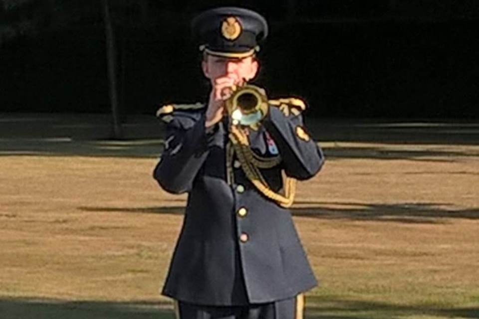 A bugler playing the Last Post during service for Sgt Pulman, Crown Copyright, All rights reserved