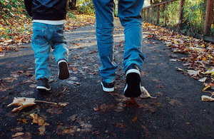 Child and parent walking.