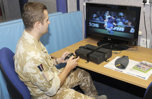 A serviceman uses one of the Xbox consoles at Brize Norton's newly-improved air terminal