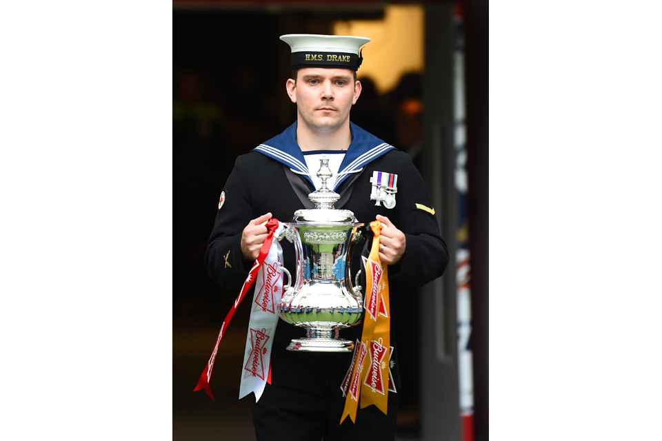 Medical Assistant Liam O'Grady with the FA Cup trophy