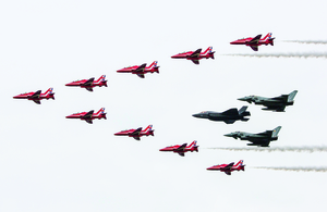 Pictured is The Royal Air Force aerobatic team, The Red Arrows, performing a fly past in formation with the RAF F35B and a pair of Typhoons at the Royal International Air Tattoo.