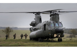 Members of 42 Commando Royal Marines board a Chinook helicopter during Exercise Pashtun Dagger on Salisbury Plain