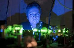 Ceres Imaging CEO Dr Ian Redmond in his lab, illuminated by green laser light