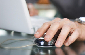 Hand on a computer mouse
