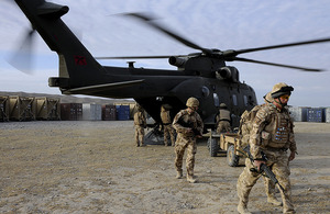 British troops disembark a Merlin helicopter