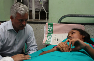 Development Minister Alan Duncan speaks with Rabeya, who was paralysed in the Rana Plaza factory collapse.