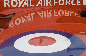 The wing and roundel of an RAF Red Arrows Hawk jet aircraft