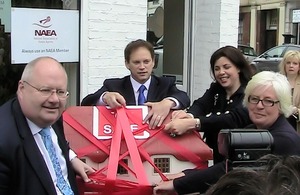 Eric Pickles, Kirsty Allsop and Grant Shapps cut red tape off a model house