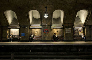 People waiting at a London tube station.