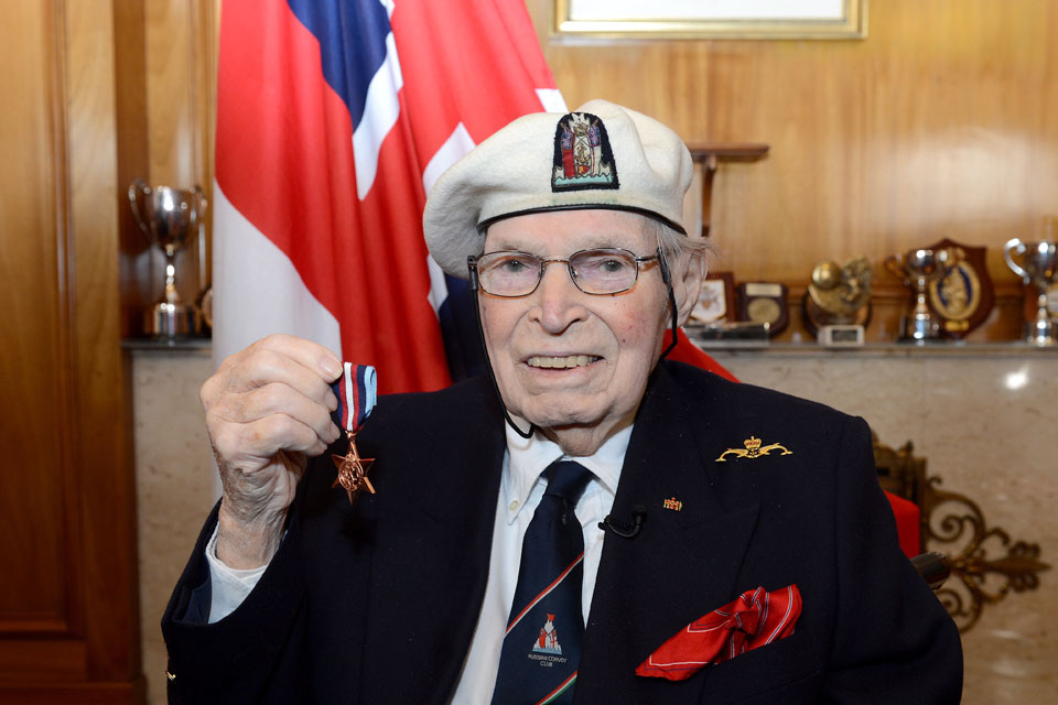 Commander Eddie Grenfell Royal Navy (Retired) with his Arctic Star medal