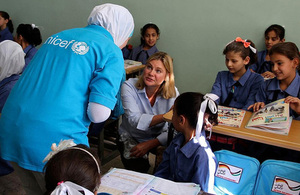 Justine Greening speaking to Syrian refugee children and a UNICEF worker in Jordan. Picture: UNICEF