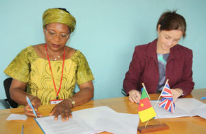 Deputy British High Commissioner, Allison Marriott signing project funding contract with representative of Cameroon's minister of Women's Empowerment and promotion .of the family.