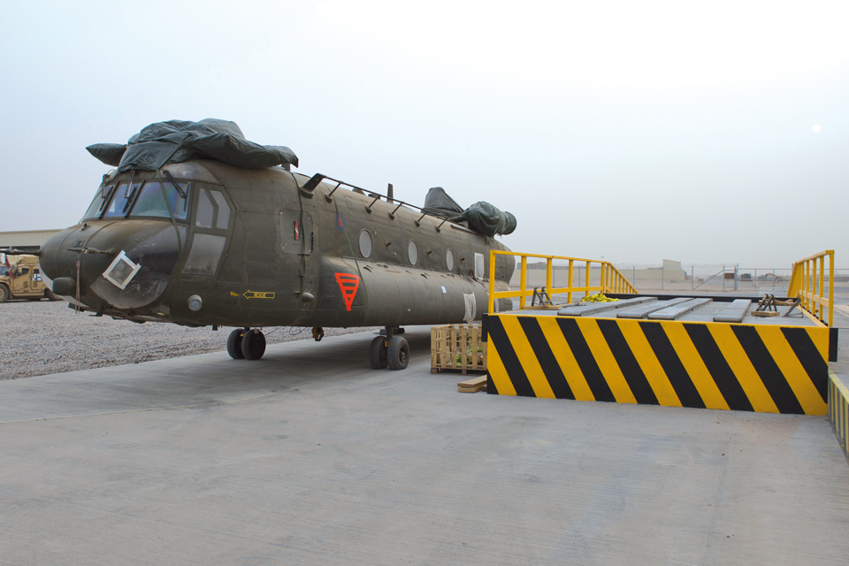 A Chinook helicopter is prepared for loading