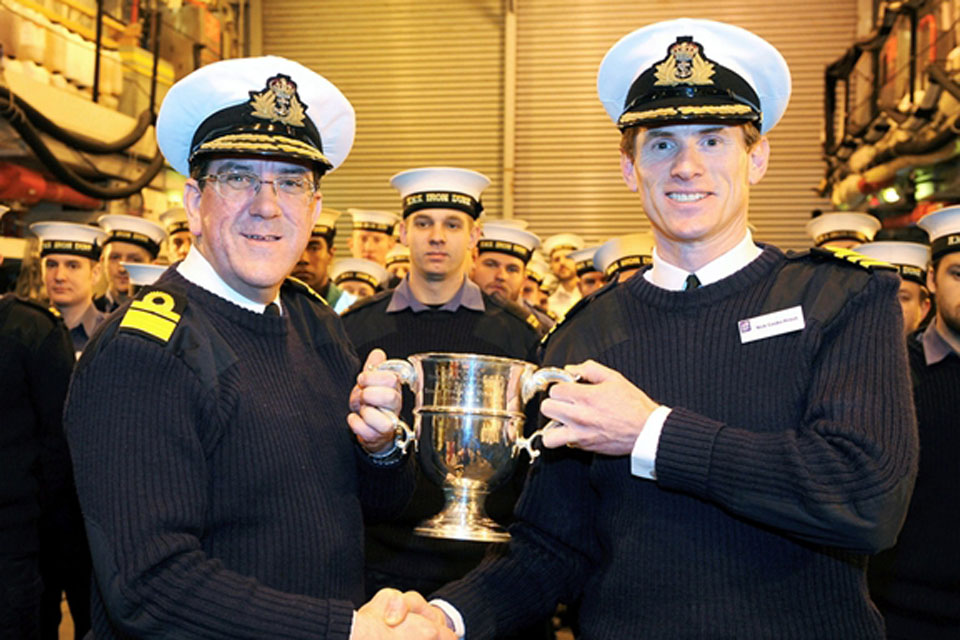 Rear Admiral Peter Hudson presenting the 2011 Frigate Efficiency Trophy to HMS Iron Duke's Commanding Officer, Commander Nick Cooke-Priest