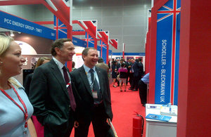 Lord Green (centre-middle) visiting UK Pavilion at the Oil & Gas Asia Conference 2013
