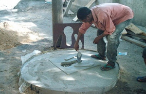 Latrine builder in Dar es Salaam learning to build slabs