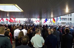 NATO staff observe a minute of silence