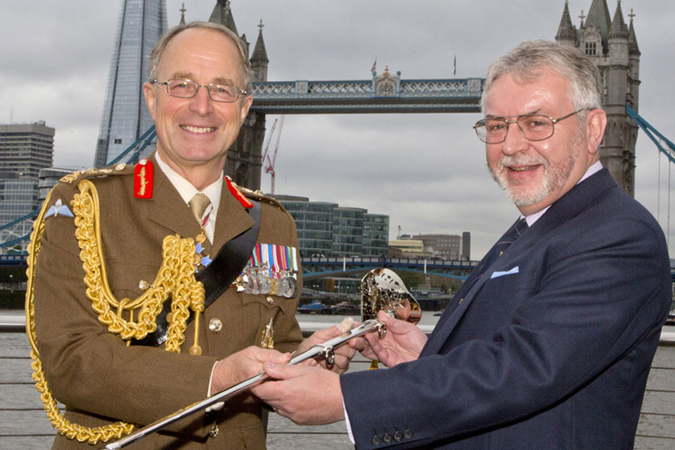 Chief of Defence Staff General Sir David Richards accepts the Firmin Sword of Peace from Mr Tony Kelly of Firmin and Sons 