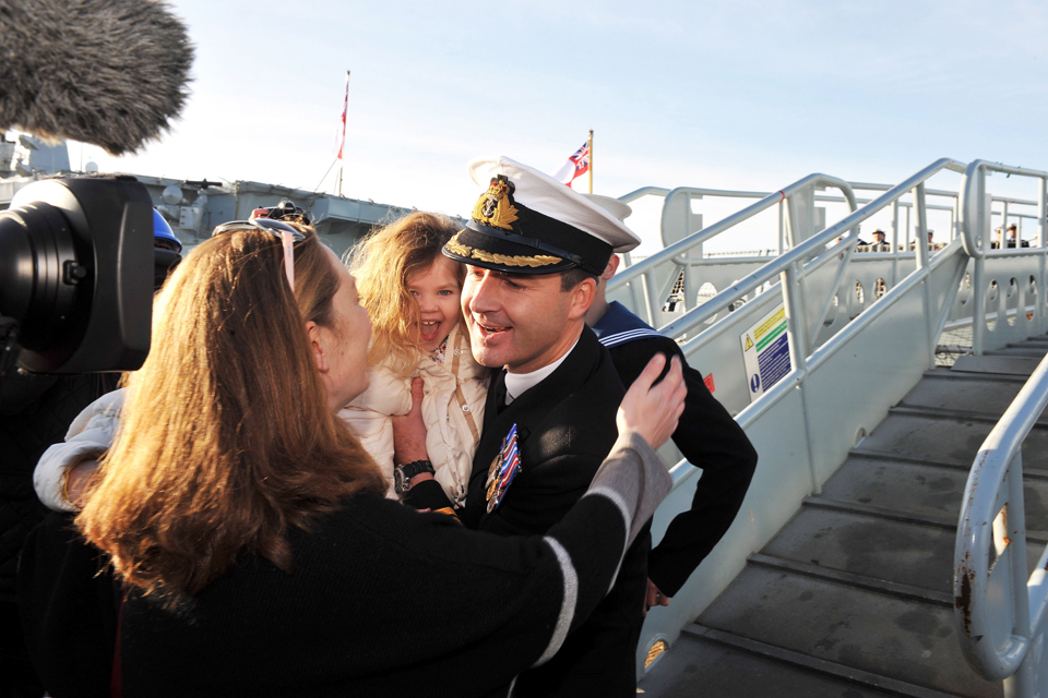 Commander Ian Clarke is greeted by his family