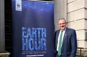 Edward Davey with the Earth Hour 2015 banner.