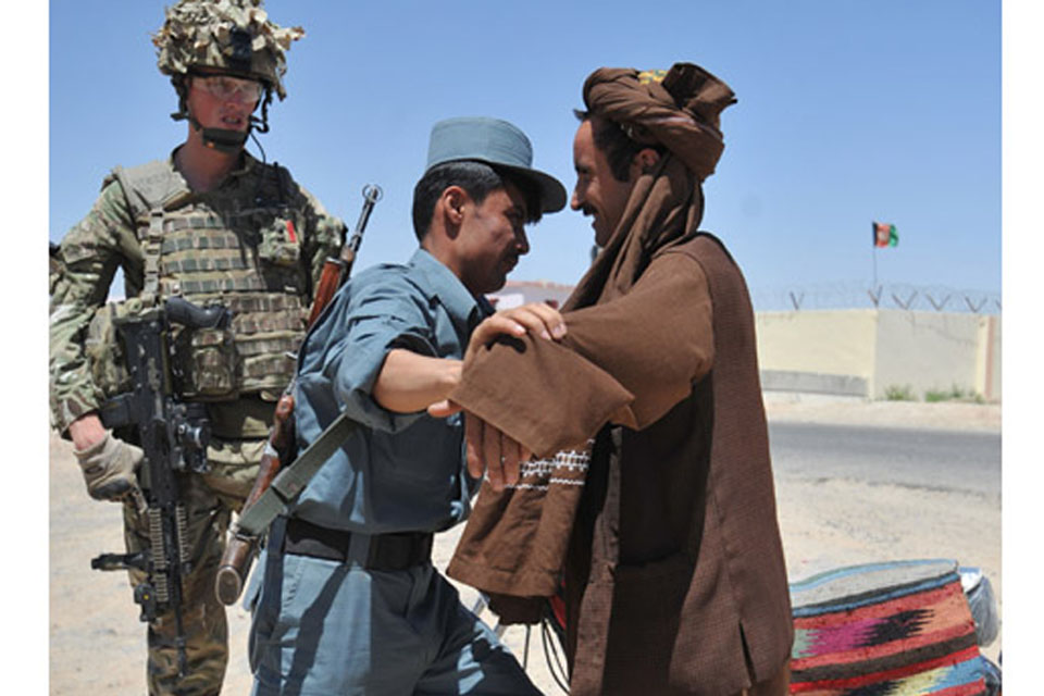 Lance Corporal Cooper working with the Afghan Uniform Police in Lashkar Gah