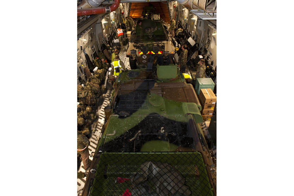 French military equipment in the cargo hold of a Royal Air Force C-17 transport aircraft