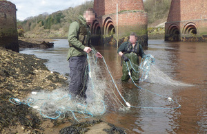 Officers pull net from river