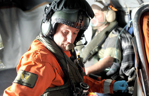 Royal Marines winchman Sergeant Tony Russell assesses one of the Andriette survivors on the way to Plymouth (library image) [Picture: Petty Officer Airman (Photographer) Paul A'Barrow, Crown copyright 2012]