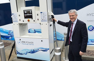 Minster Andrew Jones with a hydrogen refuelling station.